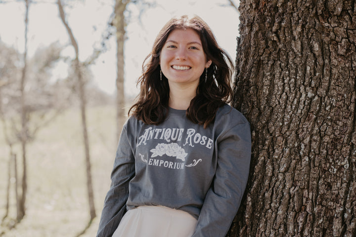 woman wearing long sleeve logo shirt
