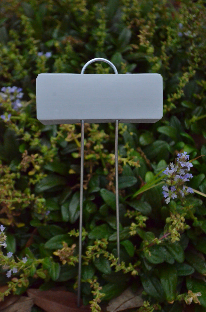 Close up of metal plant marker for rose garden