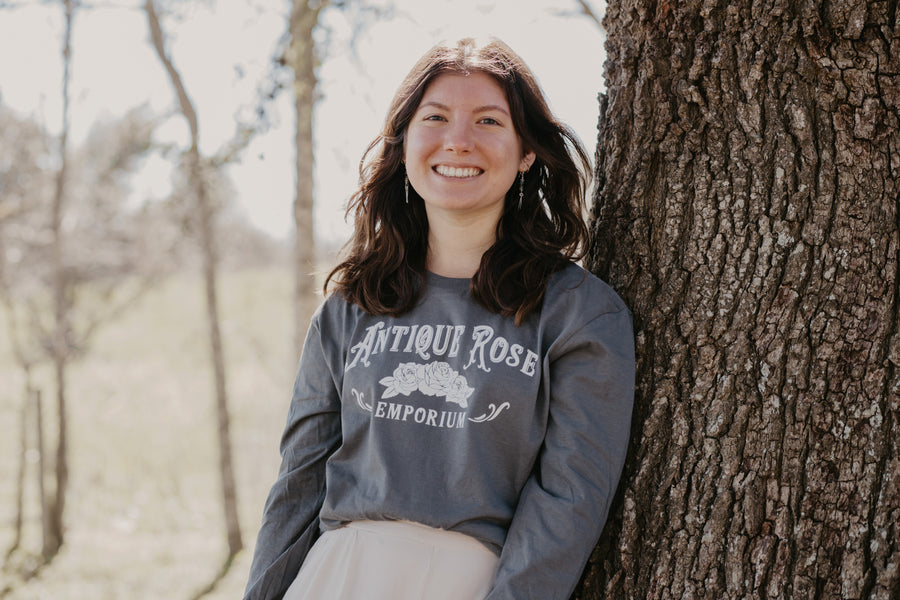 woman wearing long sleeve logo shirt
