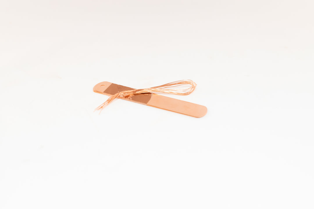stack of copper tags and ties for plant markers