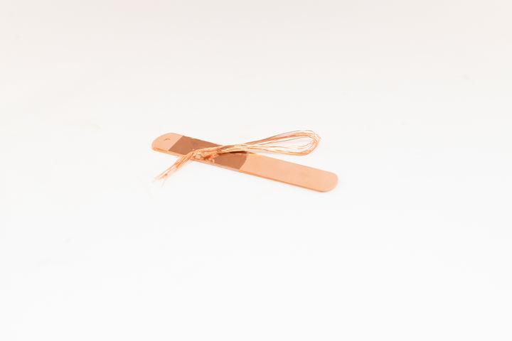 stack of copper tags and ties for plant markers